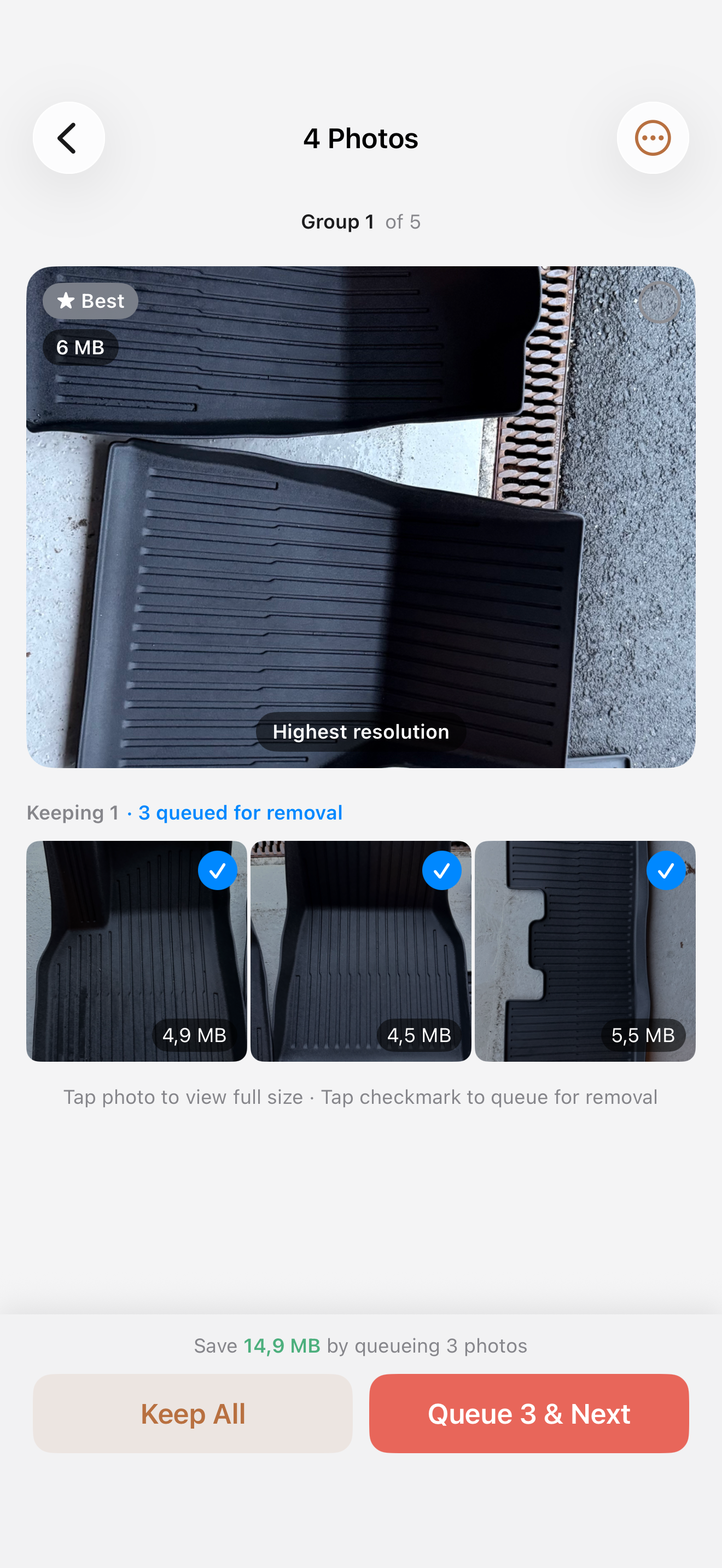 Photo group comparison with best photo selected and duplicates queued for removal